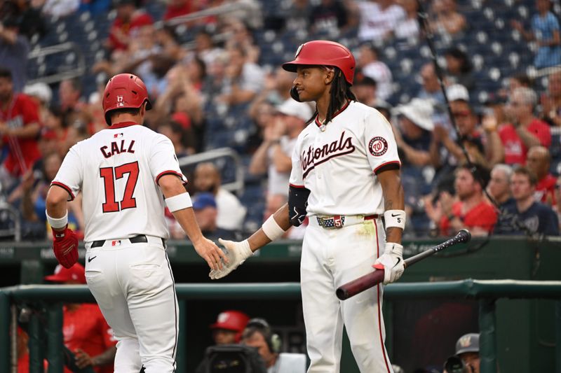 Aug 6, 2024; Washington, District of Columbia, USA; Washington Nationals right fielder Alex Call (17) celebrates scoring a run with shortstop CJ Abrams (5) against the San Francisco Giants during the second inning at Nationals Park. Mandatory Credit: Rafael Suanes-USA TODAY Sports