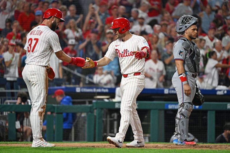 Sep 23, 2025; Philadelphia, Pennsylvania, USA; Philadelphia Phillies first base Otto Kemp (4) celebrates his two-run home run with outfielder Weston Wilson (37) during the second inning against the Miami Marlins at Citizens Bank Park. Mandatory Credit: Eric Hartline-Imagn Images