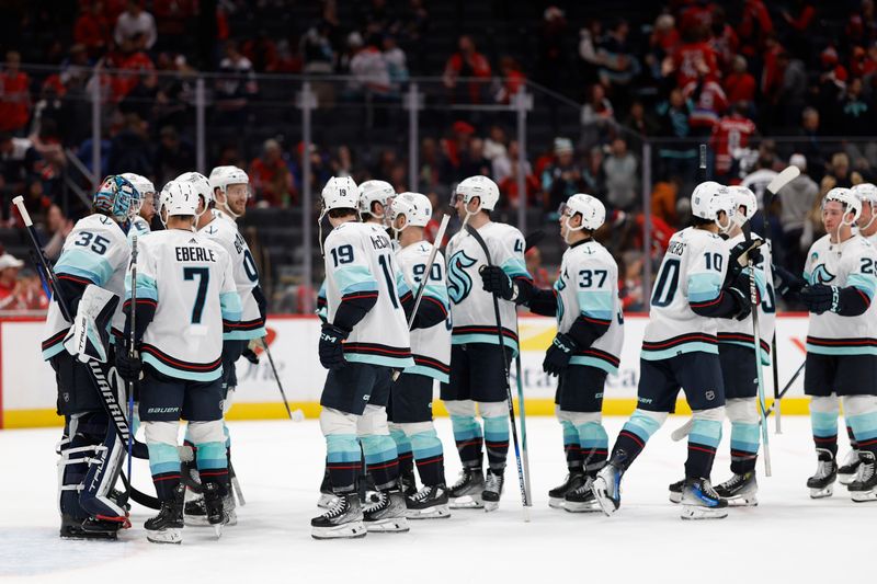 Jan 11, 2024; Washington, District of Columbia, USA; Seattle Kraken goaltender Joey Daccord (35) celebrates with teammates after their game against the Washington Capitals at Capital One Arena. Mandatory Credit: Geoff Burke-USA TODAY Sports