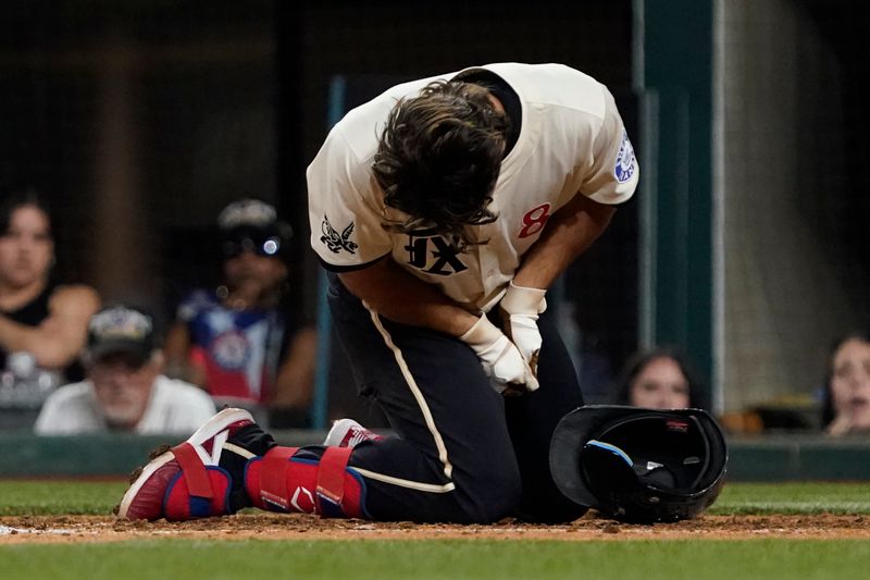 Jul 19, 2024; Arlington, Texas, USA; Texas Rangers third baseman Josh Smith (8)  reacts after being hit by a pitch during the eighth inning against the Baltimore Orioles at Globe Life Field. Mandatory Credit: Raymond Carlin III-USA TODAY Sports