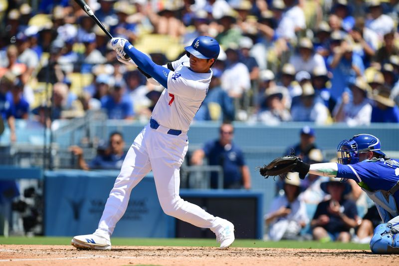 Jun 16, 2024; Los Angeles, California, USA; Los Angeles Dodgers designated hitter Shohei Ohtani (17) hits a solo home run against the Kansas City Royals during the sixth inning at Dodger Stadium. Mandatory Credit: Gary A. Vasquez-USA TODAY Sports