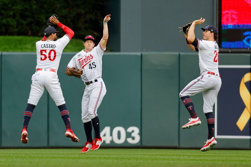 Sep 9, 2023; Minneapolis, Minnesota, USA; Minnesota Twins left fielder Willi Castro (50) and center fielder Andrew Stevenson (45) and right fielder Max Kepler (26) celebrate the win against the New York Mets at Target Field. Mandatory Credit: Bruce Kluckhohn-USA TODAY Sports