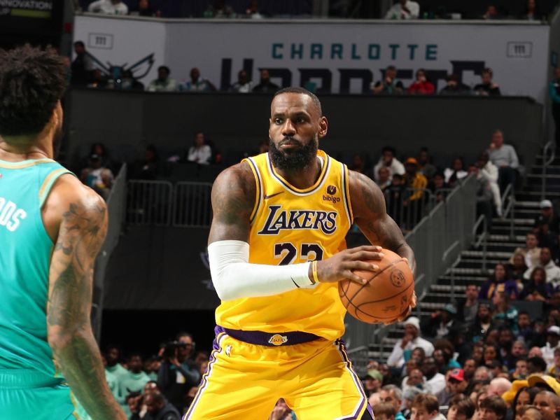 CHARLOTTE, NC - FEBRUARY 5: LeBron James #23 of the Los Angeles Lakers handles the ball during the game against the Charlotte Hornets on February 5, 2024 at Spectrum Center in Charlotte, North Carolina. NOTE TO USER: User expressly acknowledges and agrees that, by downloading and or using this photograph, User is consenting to the terms and conditions of the Getty Images License Agreement. Mandatory Copyright Notice: Copyright 2024 NBAE (Photo by Kent Smith/NBAE via Getty Images)