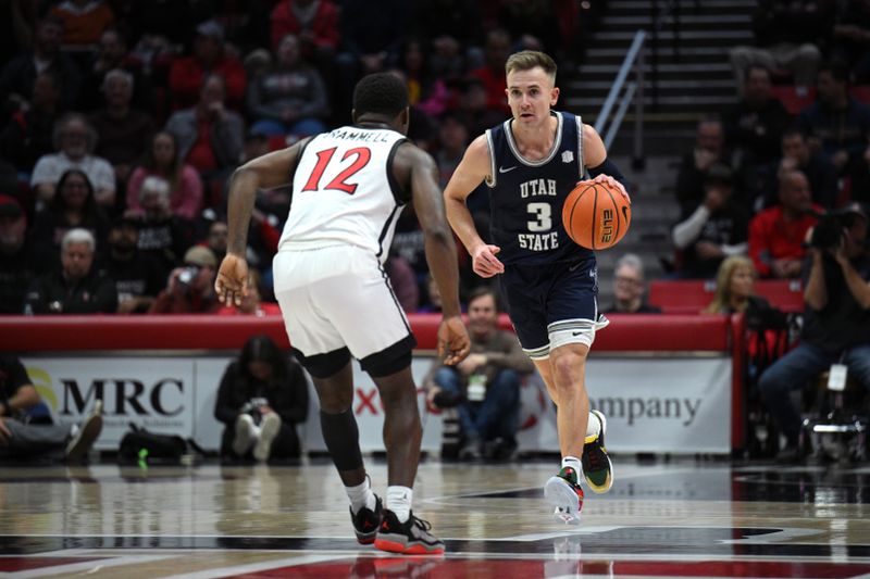 Jan 25, 2023; San Diego, California, USA; Utah State Aggies guard Steven Ashworth (3) dribbles the ball while defended by San Diego State Aztecs guard Darrion Trammell (12) during the second half at Viejas Arena. Mandatory Credit: Orlando Ramirez-USA TODAY Sports