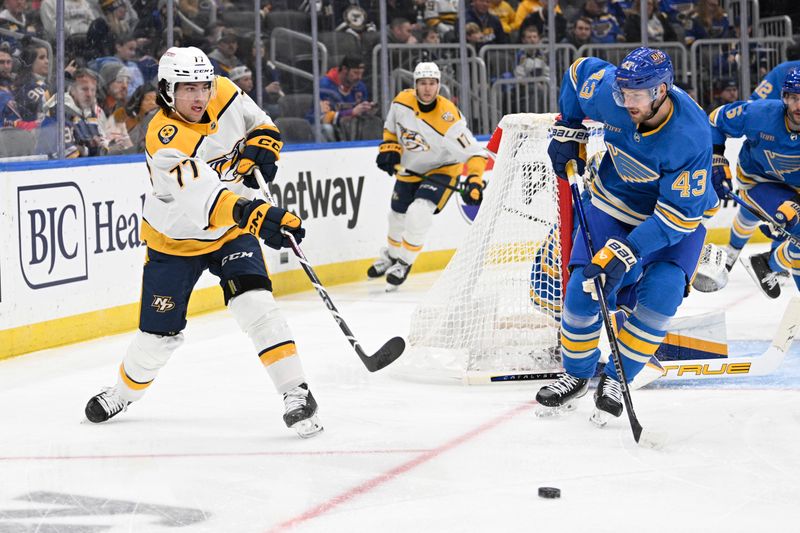 Feb 17, 2024; St. Louis, Missouri, USA; Nashville Predators right wing Luke Evangelista (77) makes a pass against St. Louis Blues defenseman Calle Rosen (43) during the first period at Enterprise Center. Mandatory Credit: Jeff Le-USA TODAY Sports