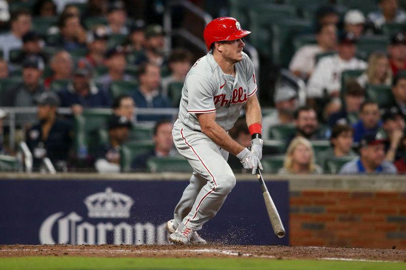 Oct 12, 2022; Atlanta, Georgia, USA; Philadelphia Phillies catcher J.T. Realmuto (10) watches his single against the Atlanta Braves in the fourth inning during game two of the NLDS for the 2022 MLB Playoffs at Truist Park. Mandatory Credit: Brett Davis-USA TODAY Sports