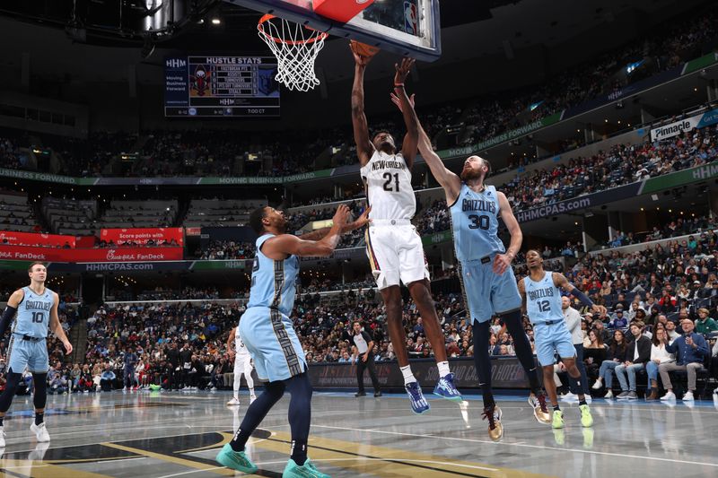 MEMPHIS, TN - NOVEMBER 29: Yves Missi #21 of the New Orleans Pelicans drives to the basket during the game against the Memphis Grizzlies during the Emirates NBA Cup game on November 29, 2024 at FedExForum in Memphis, Tennessee. NOTE TO USER: User expressly acknowledges and agrees that, by downloading and or using this photograph, User is consenting to the terms and conditions of the Getty Images License Agreement. Mandatory Copyright Notice: Copyright 2024 NBAE (Photo by Joe Murphy/NBAE via Getty Images)