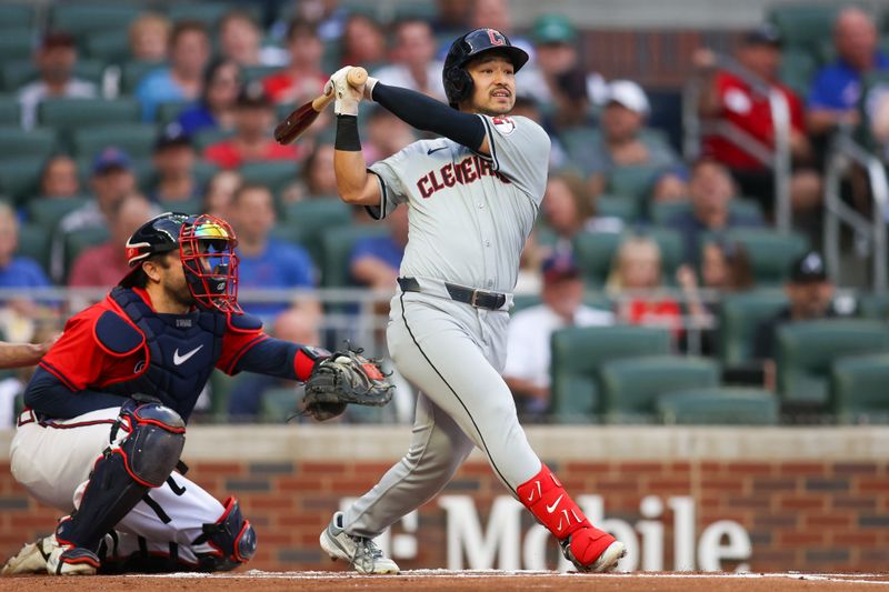 Apr 26, 2024; Atlanta, Georgia, USA; Cleveland Guardians left fielder Steven Kwan (38) hits a home run against the Atlanta Braves in the first inning at Truist Park. Mandatory Credit: Brett Davis-USA TODAY Sports