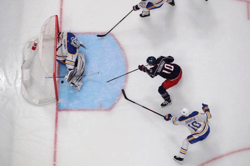 Feb 23, 2024; Columbus, Ohio, USA; Columbus Blue Jackets left wing Dmitri Voronkov (10) scores a goal over the pad of Buffalo Sabres goalie Ukko-Pekka Luukkonen (1) during the first period at Nationwide Arena. Mandatory Credit: Russell LaBounty-USA TODAY Sports