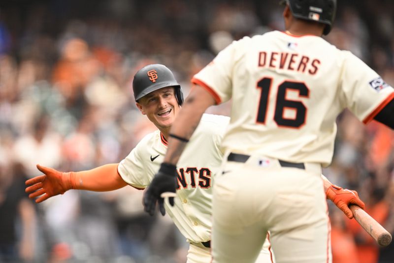 Sep 28, 2025; San Francisco, California, USA; San Francisco Giants designated hitter Rafael Devers (16) celebrates with third baseman Matt Chapman (26) after his solo home run against the Colorado Rockies in the fourth inning at Oracle Park. Mandatory Credit: Eakin Howard-Imagn Images