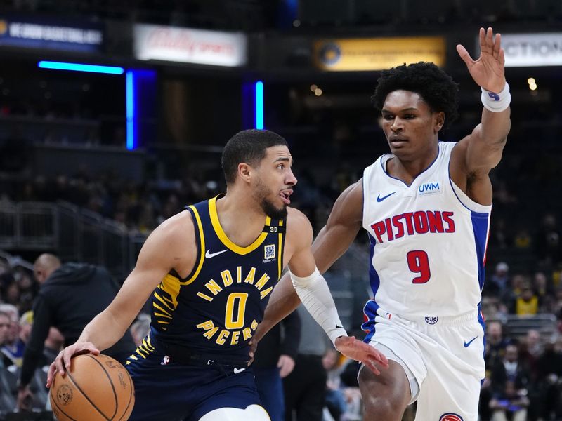 INDIANAPOLIS, INDIANA - FEBRUARY 22: Tyrese Haliburton #0 of the Indiana Pacers dribbles the ball while being guarded by Ausar Thompson #9 of the Detroit Pistons in the first quarter at Gainbridge Fieldhouse on February 22, 2024 in Indianapolis, Indiana. NOTE TO USER: User expressly acknowledges and agrees that, by downloading and or using this photograph, User is consenting to the terms and conditions of the Getty Images License Agreement. (Photo by Dylan Buell/Getty Images)