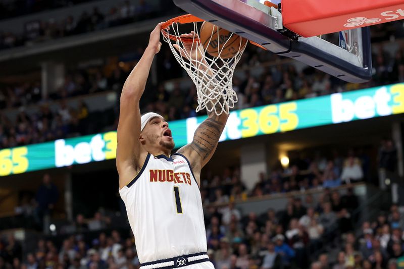 DENVER, COLORADO - OCTOBER 24: Michael Porter Jr. #1 of the Denver Nuggets dunks against the Oklahoma City Thunder in the first quarter at Ball Arena on October 24, 2024 in Denver, Colorado. NOTE TO USER: User expressly acknowledges and agrees that, by downloading and or using this photograph, User is consenting to the terms and conditions of the Getty Images License Agreement. (Photo by Matthew Stockman/Getty Images)