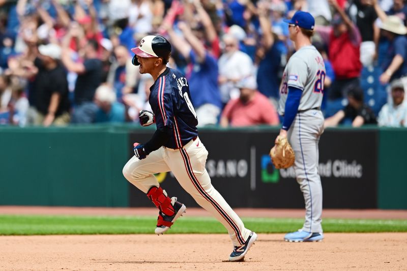 May 22, 2024; Cleveland, Ohio, USA; Cleveland Guardians second baseman Andres Gimenez (0) celebrates after hitting a three run home run during the sixth inning against the New York Mets at Progressive Field. Mandatory Credit: Ken Blaze-USA TODAY Sports
