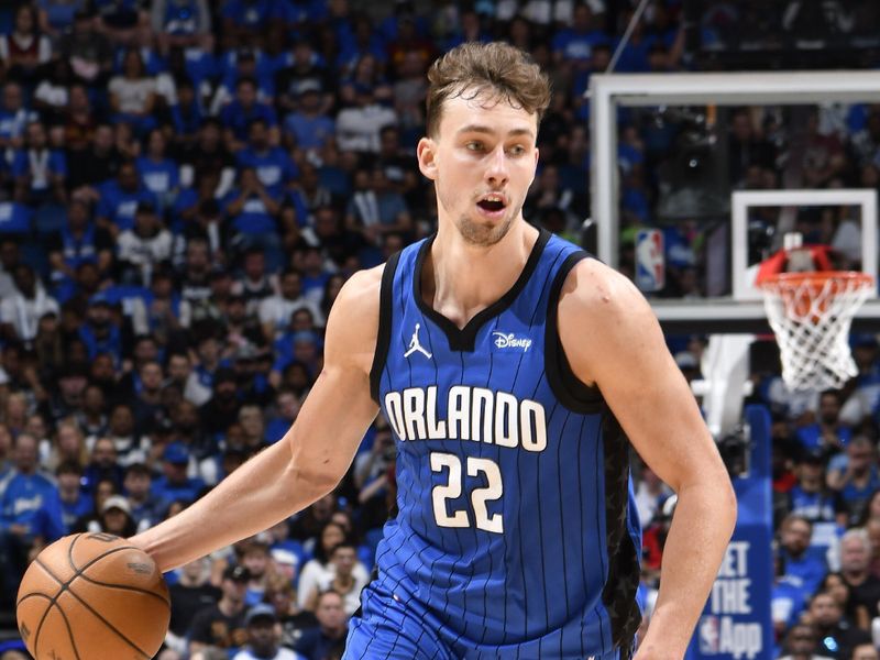 ORLANDO, FL - APRIL 27: Franz Wagner #22 of the Orlando Magic dribbles the ball during the game against the Cleveland Cavaliers during Round 1 Game 4 of the 2024 NBA Playoffs on April 27, 2024 at the Kia Center in Orlando, Florida. NOTE TO USER: User expressly acknowledges and agrees that, by downloading and or using this photograph, User is consenting to the terms and conditions of the Getty Images License Agreement. Mandatory Copyright Notice: Copyright 2024 NBAE (Photo by Fernando Medina/NBAE via Getty Images)