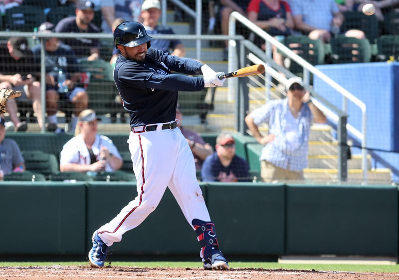 Mar 5, 2023; North Port, Florida, USA; Atlanta Braves catcher Travis d'Arnaud (16) singles during the third inning against the New York Yankees at CoolToday Park. Mandatory Credit: Kim Klement-USA TODAY Sports