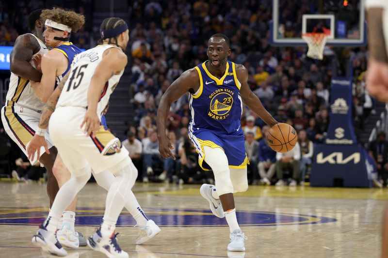 SAN FRANCISCO, CALIFORNIA - OCTOBER 30: Draymond Green #23 of the Golden State Warriors is guarded by Jose Alvarado #15 of the New Orleans Pelicans in the second quarter at Chase Center on October 30, 2024 in San Francisco, California. NOTE TO USER: User expressly acknowledges and agrees that, by downloading and/or using this photograph, user is consenting to the terms and conditions of the Getty Images License Agreement.  (Photo by Ezra Shaw/Getty Images)