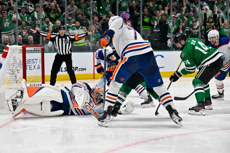 May 23, 2024; Dallas, Texas, USA; Edmonton Oilers goaltender Stuart Skinner (74) makes a save on a shot by Dallas Stars left wing Jamie Benn (14) during the overtime period in game one of the Western Conference Final of the 2024 Stanley Cup Playoffs at American Airlines Center. Mandatory Credit: Jerome Miron-USA TODAY Sports