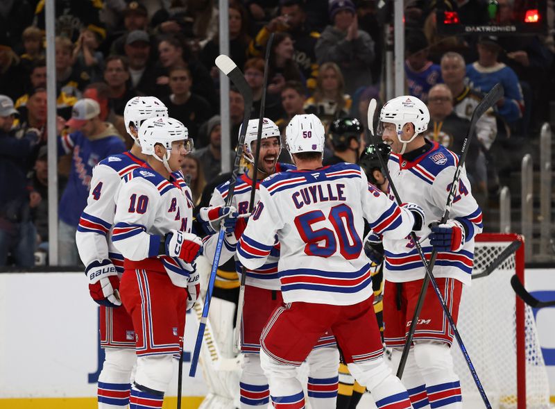 Nov 28, 2025; Boston, Massachusetts, USA; New York Rangers defenseman Carson Soucy (24), right, is congratulated by temmates after scoring against the Boston Bruins during the first period at TD Garden. Mandatory Credit: Winslow Townson-Imagn Images