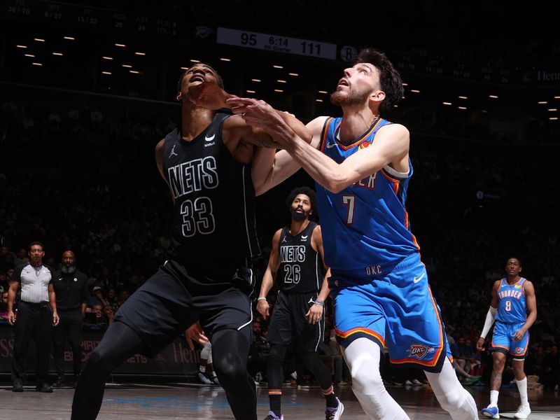 BROOKLYN, NY - JANUARY 5: Nicolas Claxton #33 of the Brooklyn Nets & Chet Holmgren #7 of the Oklahoma City Thunder boxes out during the game  on January 5, 2024 at Barclays Center in Brooklyn, New York. NOTE TO USER: User expressly acknowledges and agrees that, by downloading and or using this Photograph, user is consenting to the terms and conditions of the Getty Images License Agreement. Mandatory Copyright Notice: Copyright 2024 NBAE (Photo by Nathaniel S. Butler/NBAE via Getty Images)