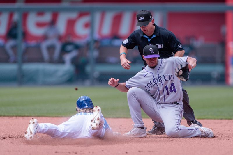 Jun 4, 2023; Kansas City, Missouri, USA; Colorado Rockies shortstop Ezequiel Tovar (14) reaches for the throw as Kansas City Royals right fielder MJ Melendez (1) slides into second base during the fifth inning at Kauffman Stadium. Mandatory Credit: William Purnell-USA TODAY Sports