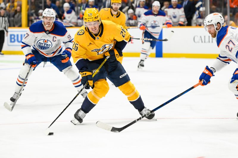 Oct 17, 2024; Nashville, Tennessee, USA;  Nashville Predators center Philip Tomasino (26) takes a shot on goal against the Edmonton Oilers during the third period at Bridgestone Arena. Mandatory Credit: Steve Roberts-Imagn Images