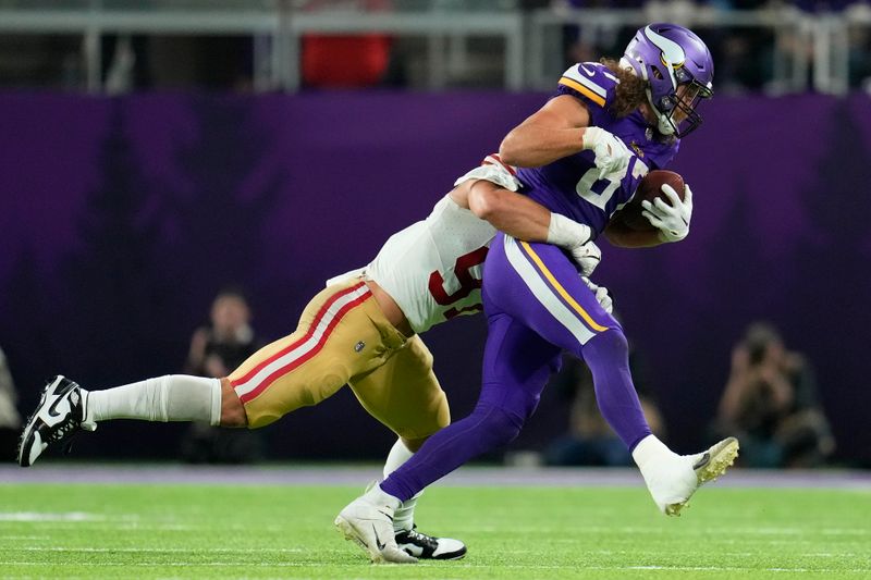 Minnesota Vikings tight end T.J. Hockenson is tackled by San Francisco 49ers defensive end Nick Bosa (97) after catching a pass during the second half of an NFL football game, Monday, Oct. 23, 2023, in Minneapolis. (AP Photo/Abbie Parr)