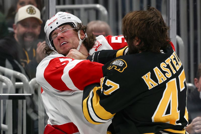 Nov 29, 2025; Boston, Massachusetts, USA; Boston Bruins center Mark Kastelic (47) lands a punch on the chin of Detroit Red Wings defenseman Moritz Seider (53) during the first period at TD Garden. Mandatory Credit: Winslow Townson-Imagn Images