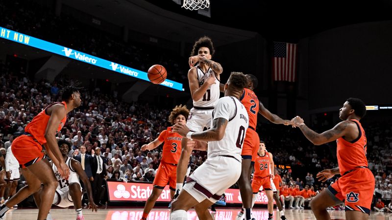 Feb 7, 2023; College Station, Texas, USA; Texas A&M Aggies forward Andersson Garcia (11) passes the ball around as Auburn Tigers defend during the second half at Reed Arena. Mandatory Credit: Maria Lysaker-USA TODAY Sports