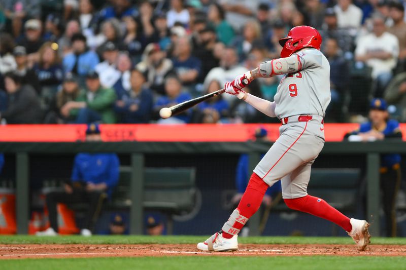 May 31, 2024; Seattle, Washington, USA; Los Angeles Angels shortstop Zach Neto (9) hits a single against the Seattle Mariners during the sixth inning at T-Mobile Park. Mandatory Credit: Steven Bisig-USA TODAY Sports