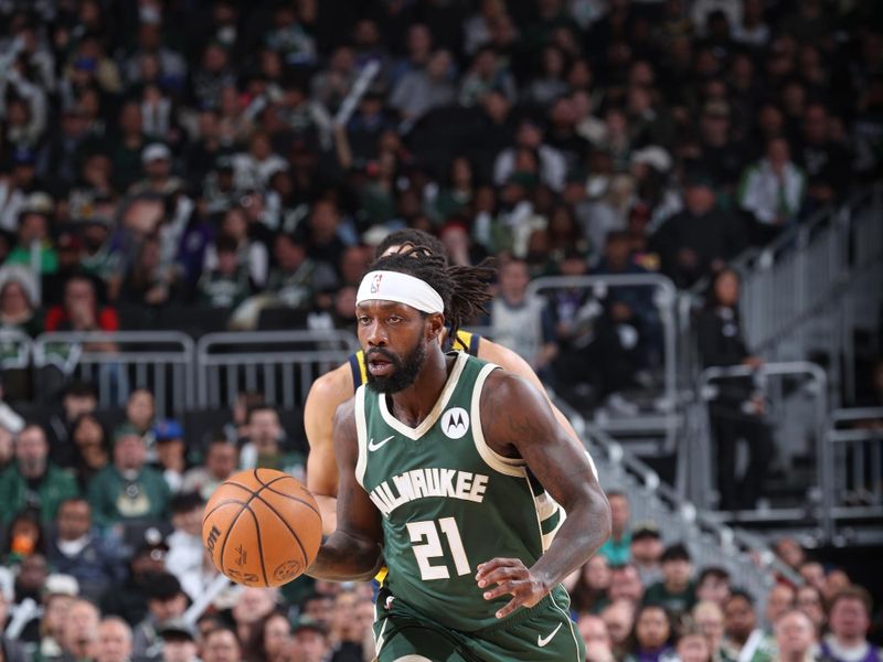 MILWAUKEE, WI - APRIL 21:  Patrick Beverley #21 of the Milwaukee Bucks handles the ball during the game  against the Indiana Pacers during Round 1 Game 1 of the 2024 NBA Playoffs  on April 21, 2024 at the Fiserv Forum Center in Milwaukee, Wisconsin. NOTE TO USER: User expressly acknowledges and agrees that, by downloading and or using this Photograph, user is consenting to the terms and conditions of the Getty Images License Agreement. Mandatory Copyright Notice: Copyright 2024 NBAE (Photo by Jeff Haynes/NBAE via Getty Images).