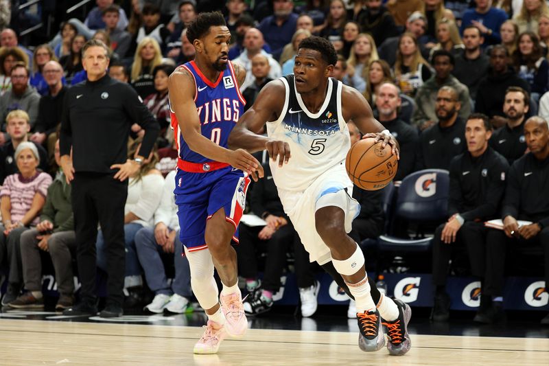 MINNEAPOLIS, MINNESOTA - NOVEMBER 27: Anthony Edwards #5 of the Minnesota Timberwolves drives to the basket against Malik Monk #0 of the Sacramento Kings in the first quarter at Target Center on November 27, 2024 in Minneapolis, Minnesota. NOTE TO USER: User expressly acknowledges and agrees that, by downloading and or using this photograph, User is consenting to the terms and conditions of the Getty Images License Agreement. (Photo by David Berding/Getty Images)