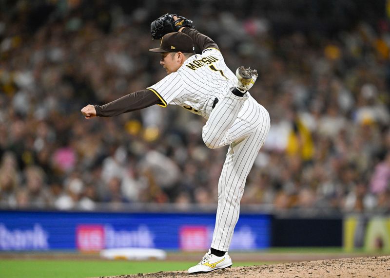 May 27, 2025; San Diego, California, USA; San Diego Padres pitcher Yuki Matsui (1) delivers during the seventh inning against the Miami Marlins at Petco Park. Mandatory Credit: Denis Poroy-Imagn Images