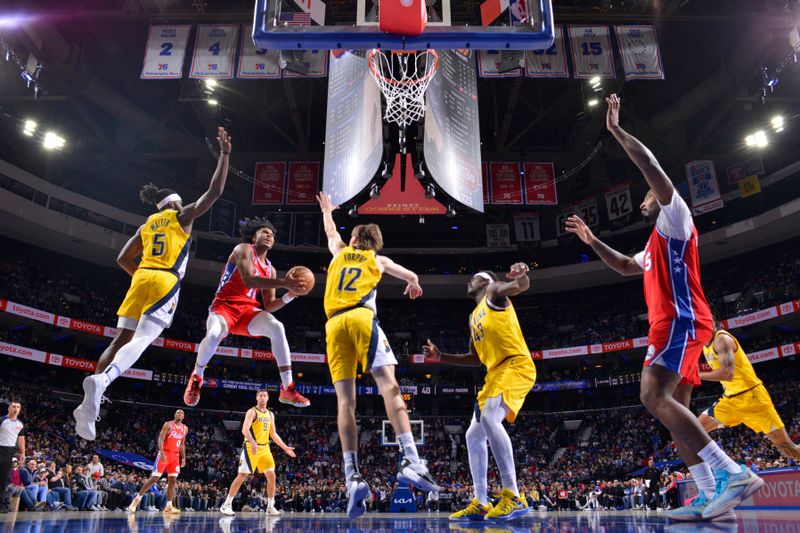 PHILADELPHIA, PA - DECEMBER 13: Ricky Council IV #14 of the Philadelphia 76ers drives to the basket during the game against the Indiana Pacers on December 13, 2024 at the Wells Fargo Center in Philadelphia, Pennsylvania NOTE TO USER: User expressly acknowledges and agrees that, by downloading and/or using this Photograph, user is consenting to the terms and conditions of the Getty Images License Agreement. Mandatory Copyright Notice: Copyright 2024 NBAE (Photo by Jesse D. Garrabrant/NBAE via Getty Images)