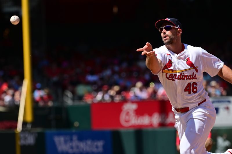 Jun 9, 2024; St. Louis, Missouri, USA; St. Louis Cardinals first base Paul Goldschmidt (46) tosses to first base for the out on Colorado Rockies bench coach Mike Redmond (not shown) in the seventh inning at Busch Stadium. Mandatory Credit: Tim Vizer-USA TODAY Sports