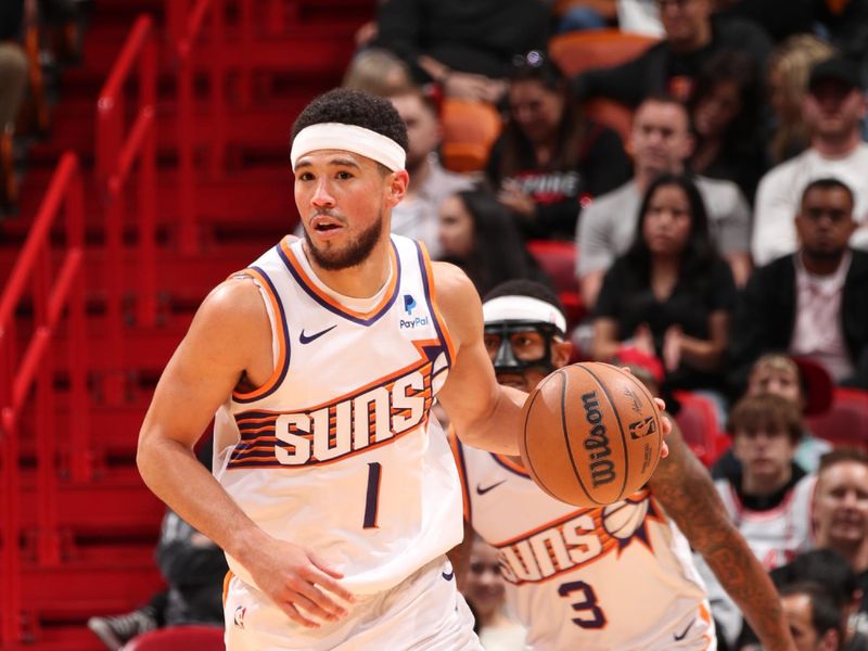 MIAMI, FL - JANUARY 29: Devin Booker #1 of the Phoenix Suns dribbles the ball during the game against the Miami Heat on January 29, 2024 at Kaseya Center in Miami, Florida. NOTE TO USER: User expressly acknowledges and agrees that, by downloading and or using this Photograph, user is consenting to the terms and conditions of the Getty Images License Agreement. Mandatory Copyright Notice: Copyright 2024 NBAE (Photo by Issac Baldizon/NBAE via Getty Images)