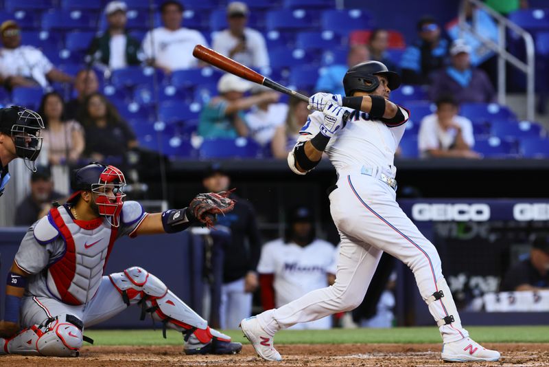 Apr 29, 2024; Miami, Florida, USA; Miami Marlins second baseman Luis Arraez (3) hits a double against the Washington Nationals during the third inning at loanDepot Park. Mandatory Credit: Sam Navarro-USA TODAY Sports