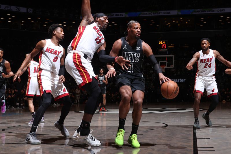 BROOKLYN, NY - JANUARY 15: Dennis Smith Jr. #4 of the Brooklyn Nets dribbles the ball during the game against the Miami Heat on January 15, 2024 at Barclays Center in Brooklyn, New York. NOTE TO USER: User expressly acknowledges and agrees that, by downloading and or using this Photograph, user is consenting to the terms and conditions of the Getty Images License Agreement. Mandatory Copyright Notice: Copyright 2024 NBAE (Photo by Nathaniel S. Butler/NBAE via Getty Images)