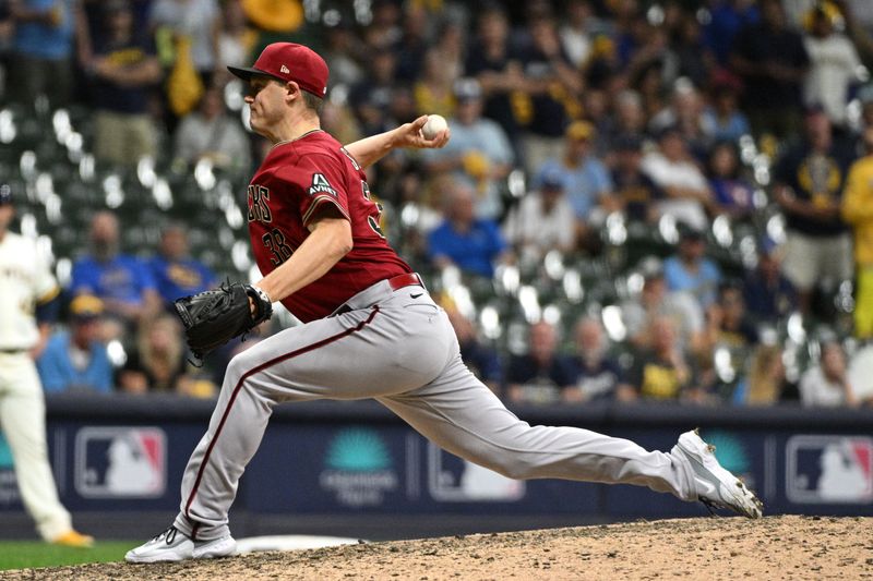 Oct 3, 2023; Milwaukee, Wisconsin, USA; Arizona Diamondbacks relief pitcher Paul Sewald (38) pitches against the Milwaukee Brewers in the ninth inning during game one of the Wildcard series for the 2023 MLB playoffs at American Family Field. Mandatory Credit: Michael McLoone-USA TODAY Sports