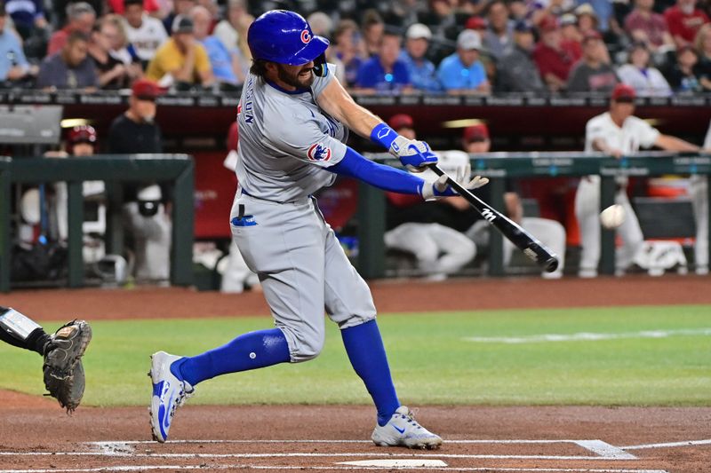 Apr 17, 2024; Phoenix, Arizona, USA;  Chicago Cubs shortstop Dansby Swanson (7) singles in the first inning against the Arizona Diamondbacks at Chase Field. Mandatory Credit: Matt Kartozian-USA TODAY Sports