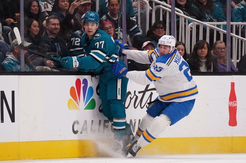 Mar 6, 2026; San Jose, California, USA; San Jose Sharks center Michael Misa (77) and St. Louis Blues defenseman Logan Mailloux (23) collide in the first period at SAP Center at San Jose. Mandatory Credit: David Gonzales-Imagn Images