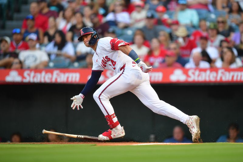 Jul 26, 2024; Anaheim, California, USA; Los Angeles Angels catcher Logan O'Hoppe (14) hits a single against the Oakland Athletics during the first inning at Angel Stadium. Mandatory Credit: Gary A. Vasquez-USA TODAY Sports