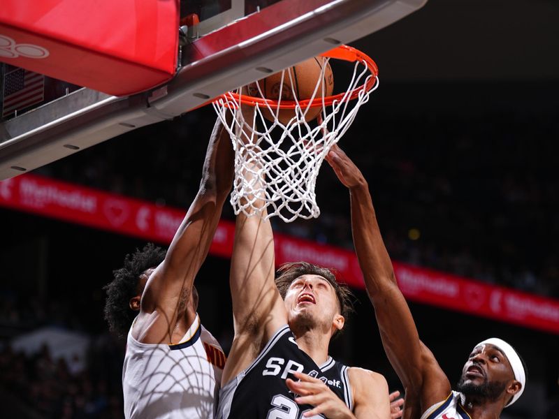 SAN ANTONIO, TX - APRIL 12: Zach Collins #23 of the San Antonio Spurs drives to the basket during the game against the Denver Nuggets on April 12, 2024 at the Frost Bank Center in San Antonio, Texas. NOTE TO USER: User expressly acknowledges and agrees that, by downloading and or using this photograph, user is consenting to the terms and conditions of the Getty Images License Agreement. Mandatory Copyright Notice: Copyright 2024 NBAE (Photos by Garrett Ellwood/NBAE via Getty Images)