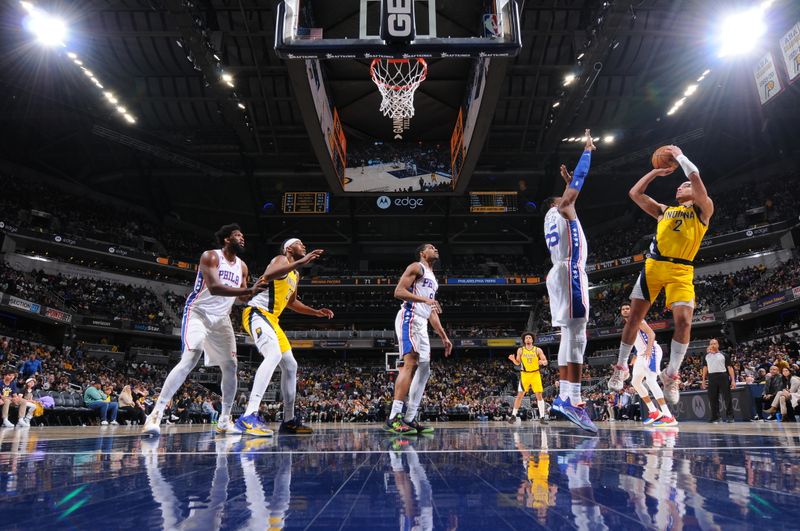 INDIANAPOLIS, IN - MARCH 18: Andrew Nembhard #2 of the Indiana Pacers drives to the basket during the game against the Philadelphia 76ers on March 18, 2023 at Gainbridge Fieldhouse in Indianapolis, Indiana. NOTE TO USER: User expressly acknowledges and agrees that, by downloading and or using this Photograph, user is consenting to the terms and conditions of the Getty Images License Agreement. Mandatory Copyright Notice: Copyright 2023 NBAE (Photo by Ron Hoskins/NBAE via Getty Images)