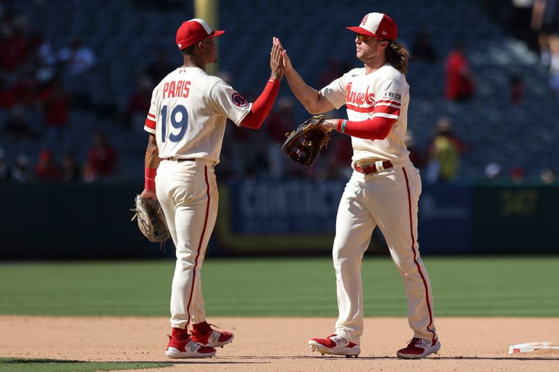 Sep 10, 2023; Anaheim, California, USA; Los Angeles Angels center fielder Brett Phillips (4) celebrates with Los Angeles Angels second baseman Kyren Paris (19) after the Los Angeles Angels defeat the Cleveland Guardians at Angel Stadium. Mandatory Credit: Jessica Alcheh-USA TODAY Sports