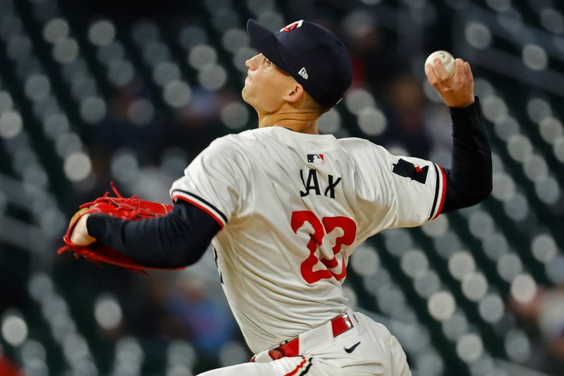 Apr 24, 2024; Minneapolis, Minnesota, USA; Minnesota Twins relief pitcher Griffin Jax (22) throws to the Chicago White Sox in the ninth inning at Target Field. Mandatory Credit: Bruce Kluckhohn-USA TODAY Sports