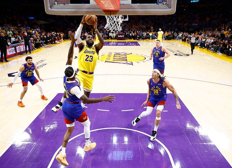 LOS ANGELES, CALIFORNIA - APRIL 25:  LeBron James #23 of the Los Angeles Lakers takes a shot against Kentavious Caldwell-Pope #5 of the Denver Nuggets in the first quarter during game three of the Western Conference First Round Playoffs at Crypto.com Arena on April 25, 2024 in Los Angeles, California.  (Photo by Ronald Martinez/Getty Images)