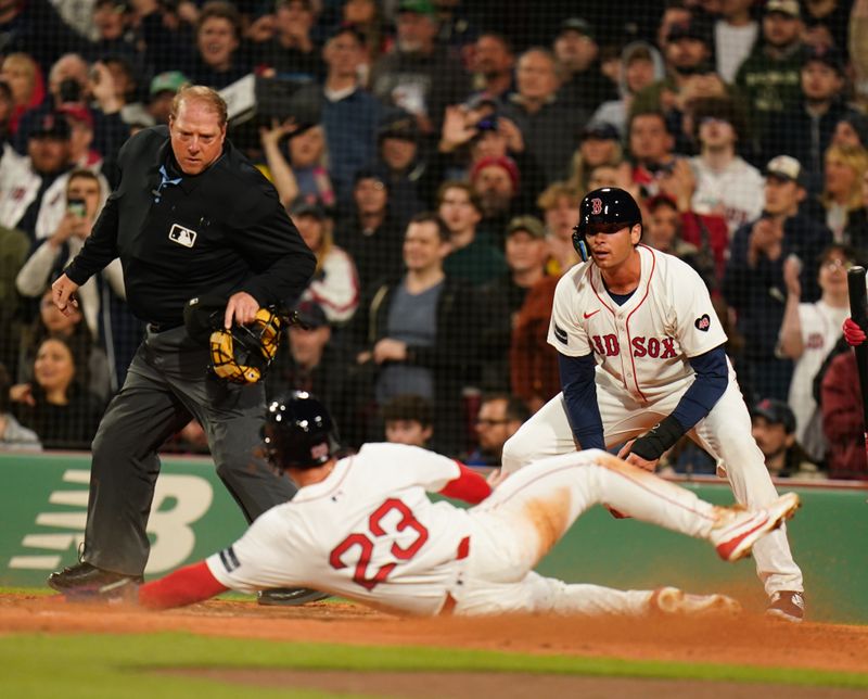 Apr 10, 2024; Boston, Massachusetts, USA; Boston Red Sox shortstop Romy Gonzalez (23) scores against the Baltimore Orioles in the fourth inning at Fenway Park. Mandatory Credit: David Butler II-USA TODAY Sports