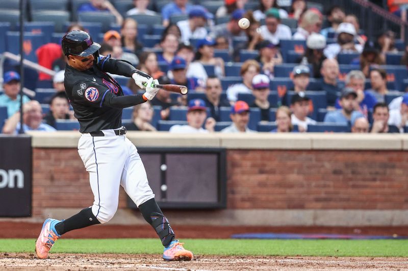 Jul 12, 2024; New York City, New York, USA;  New York Mets third baseman Mark Vientos (27) hits a solo home run in the second inning against the Colorado Rockies at Citi Field. Mandatory Credit: Wendell Cruz-USA TODAY Sports