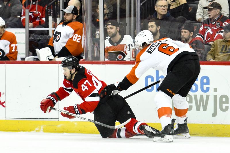 Jan 29, 2025; Newark, New Jersey, USA; Philadelphia Flyers defenseman Travis Sanheim (6) checks New Jersey Devils center Paul Cotter (47) during the first period at Prudential Center. Mandatory Credit: John Jones-Imagn Images