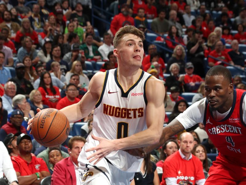 NEW ORLEANS, LA - NOVEMBER 15: Christian Braun #0 of the Denver Nuggets drives to the basket during the game against the New Orleans Pelicans during the Emirates NBA Cup game on November 15, 2024 at the Smoothie King Center in New Orleans, Louisiana. NOTE TO USER: User expressly acknowledges and agrees that, by downloading and or using this Photograph, user is consenting to the terms and conditions of the Getty Images License Agreement. Mandatory Copyright Notice: Copyright 2024 NBAE (Photo by Layne Murdoch Jr./NBAE via Getty Images)